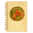 Spiral-bound notebook with beige cover featuring nature-themed illustration of bird, mushrooms, flowers, and text