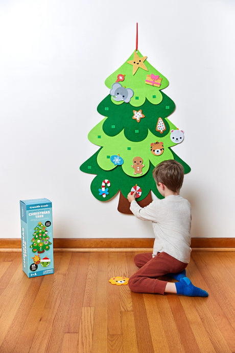 Decorate Your Own Christmas Tree felt wall decoration with child adding colorful ornaments at home