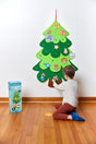 Decorate Your Own Christmas Tree felt wall decoration with child adding colorful ornaments at home