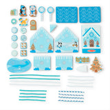 Wooden winter-themed play set with house pieces and reusable blue and white icing cords for festive decoration