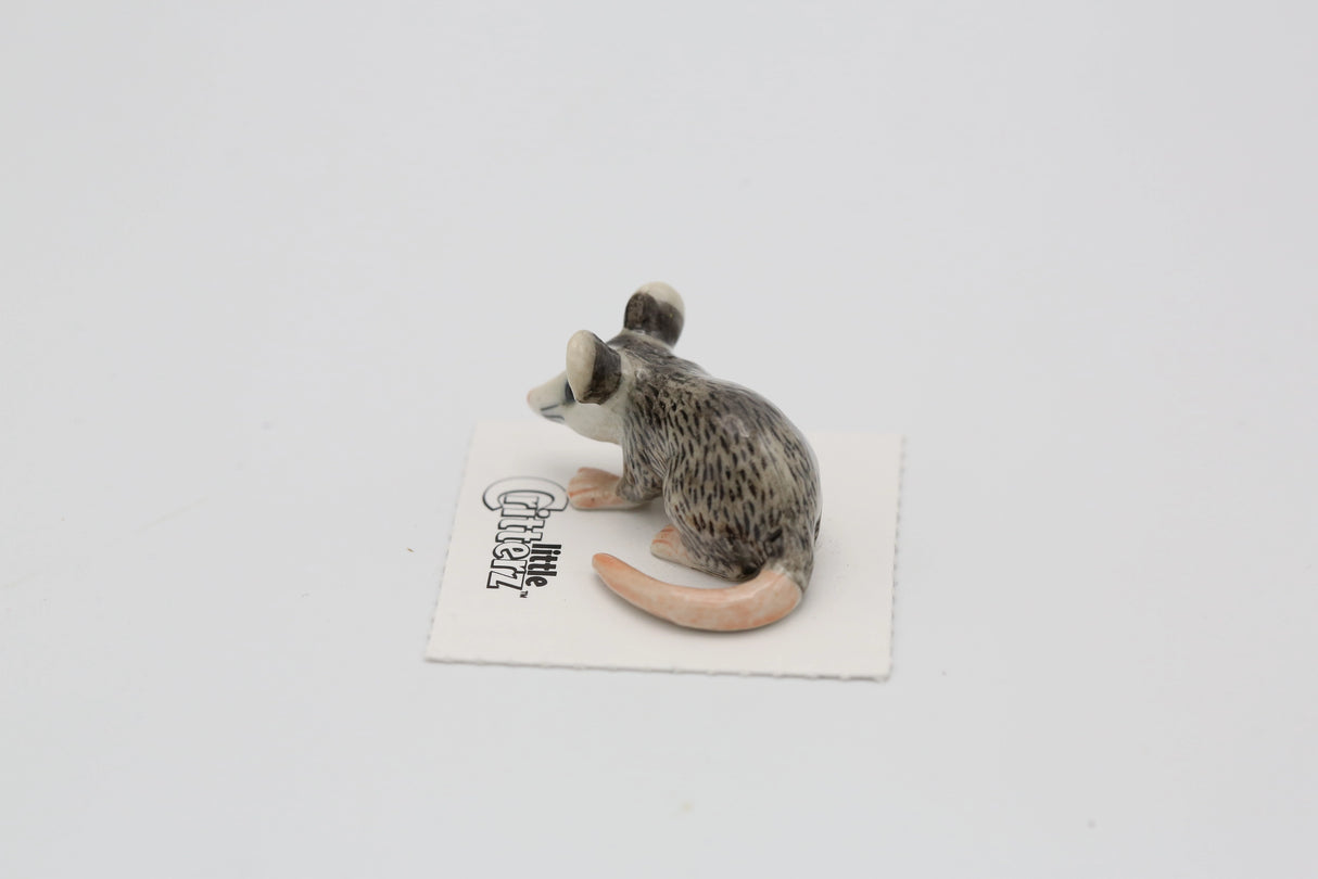Critterz Thumbs Opossum miniature porcelain figurine with detailed gray and pink coloring on display card.
