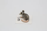 Critterz Thumbs Opossum miniature porcelain figurine with detailed gray and pink coloring on display card.