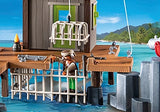 PLAYMOBIL Pirates | Pirate Harbor with pirate figure in jail cage by the dock, surrounded by water and harbor features.