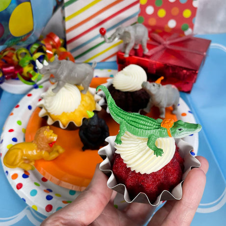 TOOB | Party Animals showing 6 detailed animal figurines on cupcakes with party hats and accessories.
