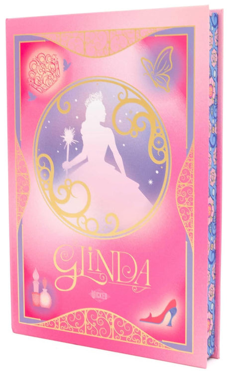 Wicked Glinda Journal with pink cover, gold detailing, and silhouette of Glinda holding a wand, deluxe hardcover design.