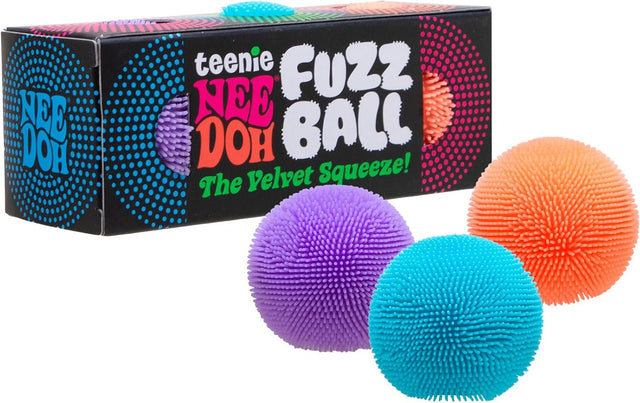 Three colorful teenie fuzz balls with soft textured spikes next to black packaging with bright text and designs