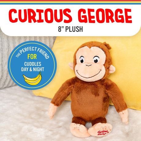 Curious George | 8 inch plush toy sitting on a soft surface with a yellow pillow background.