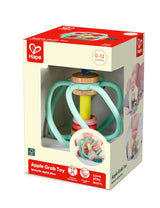 Colorful baby apple grab toy with soft silicone bars and wooden parts packaged for ages 0 to 12 months.