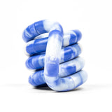 Blue and white marble patterned spiral tangle fidget toy designed to enhance focus and creativity