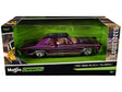 Purple lowrider model car with custom paint and chrome wheels displayed in green and black Maisto Design packaging
