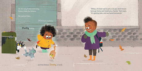 Ethan and the Strays shows a young boy with kittens outside on a city sidewalk in autumn.