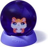 Interactive Bitzee hamster toy inside a glowing purple hamster ball with a matching stand on a white background