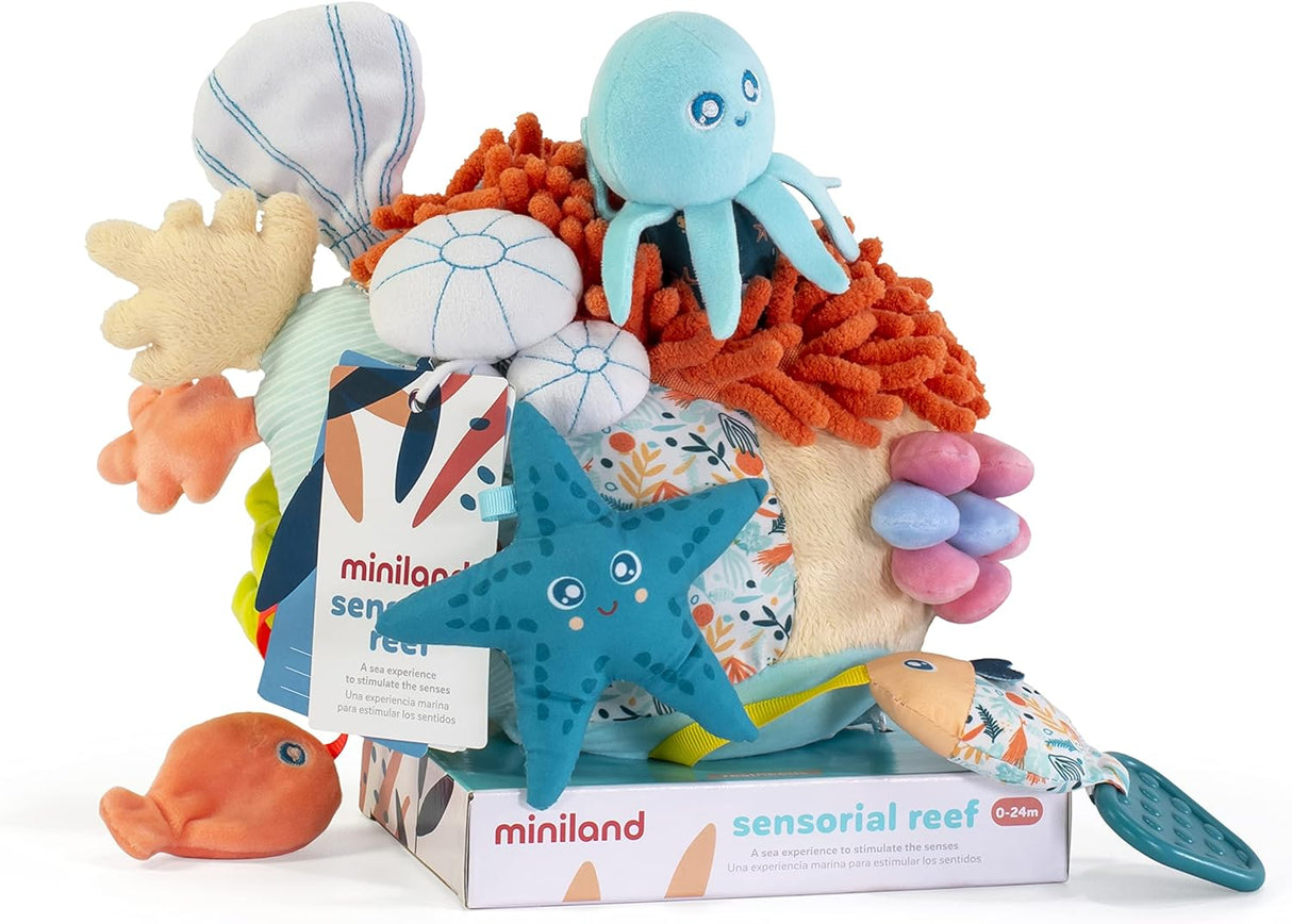 Sensorial Reef baby toy with squeezable coral, octopus rattle, starfish, and colorful seabed elements for sensory play.