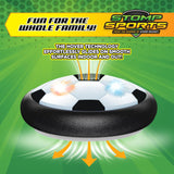Black and white hover soccer puck with glowing lights demonstrating smooth gliding on indoor surfaces like wood and tile