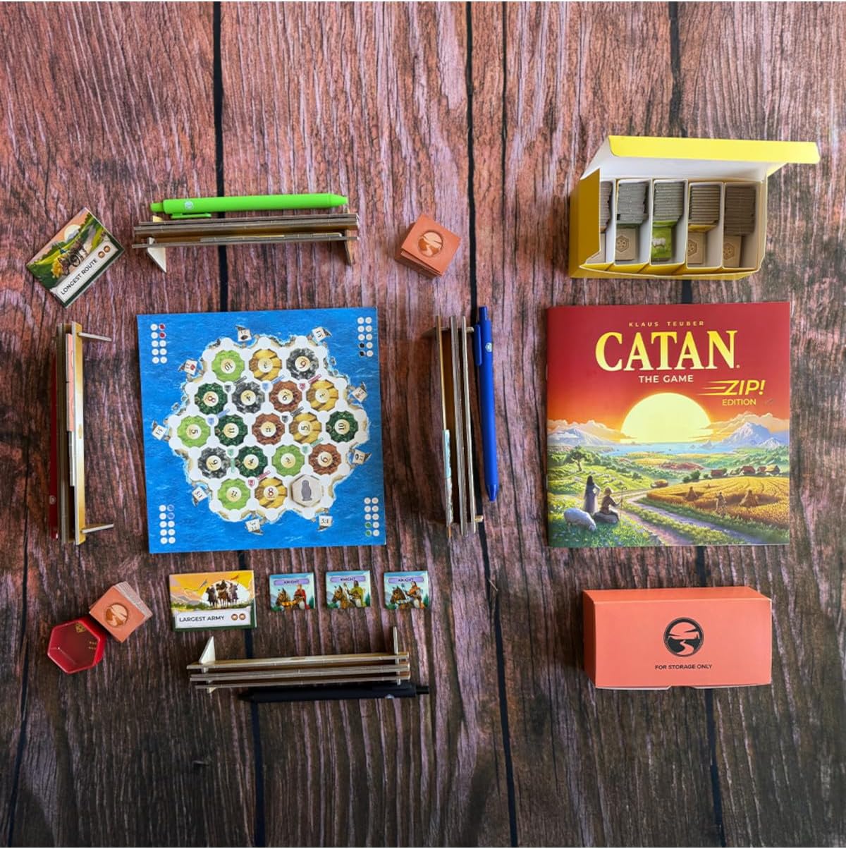Catan Zip! board game with hexagonal game board cards wooden pieces and play accessories