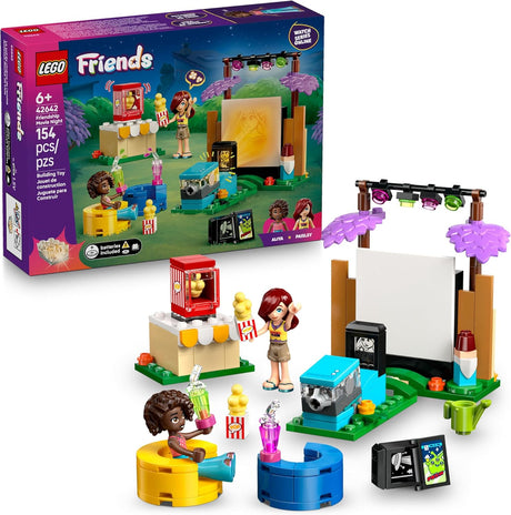 LEGO Friends Friendship Movie Night set with projector, popcorn machine, beanbag chairs, and two mini dolls enjoying backyard movie fun