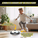 Young boy playing with a hovering soccer toy featuring LED lights and soft foam bumpers for indoor fun