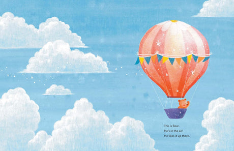 Bear in the Air shows a bear flying happily in a colorful hot air balloon high above white clouds.