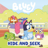 Bluey and friends playing outdoors with toys in a colorful scene from the Hide and Seek book for toddlers
