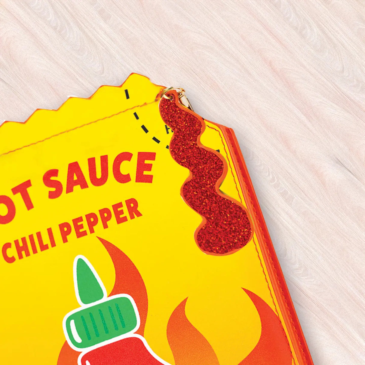 Crossbody Handbag | Hot Sauce featuring bright yellow chili pepper design with playful glittery sauce detail on light background