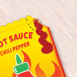 Crossbody Handbag | Hot Sauce featuring bright yellow chili pepper design with playful glittery sauce detail on light background