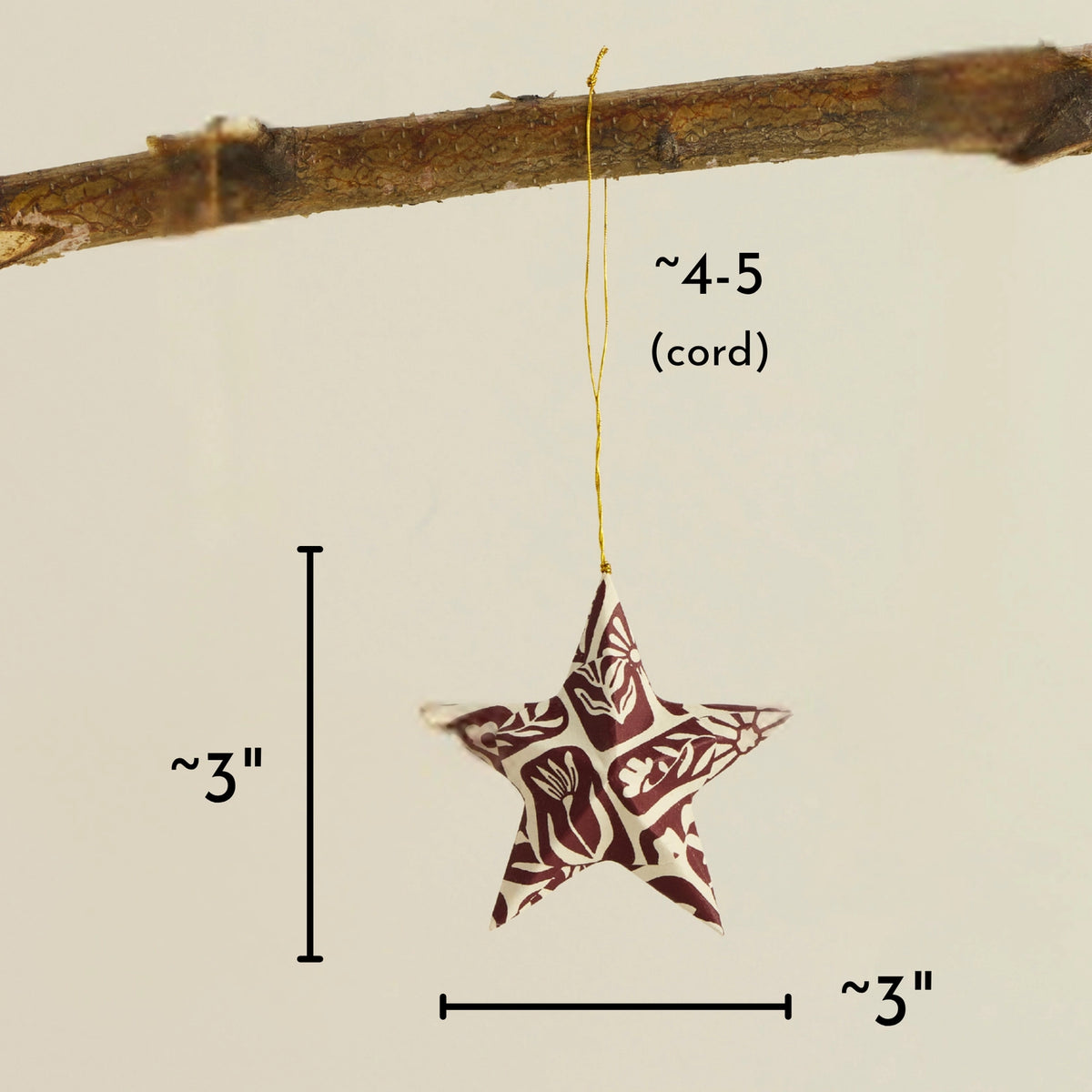 Colorful Floral Paper Star Ornament hanging from a cord