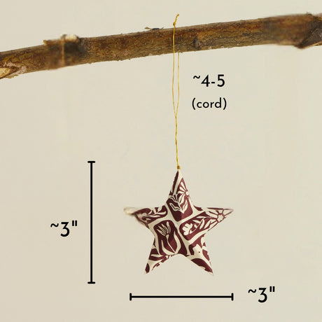 Colorful Floral Paper Star Ornament hanging from a cord