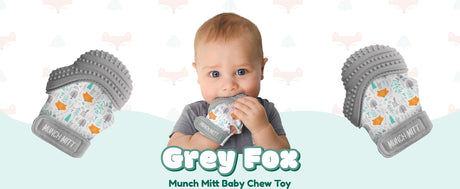 Munch Mitt | Grey Woodland teething mitt worn by baby with textured silicone surfaces for soothing gums.