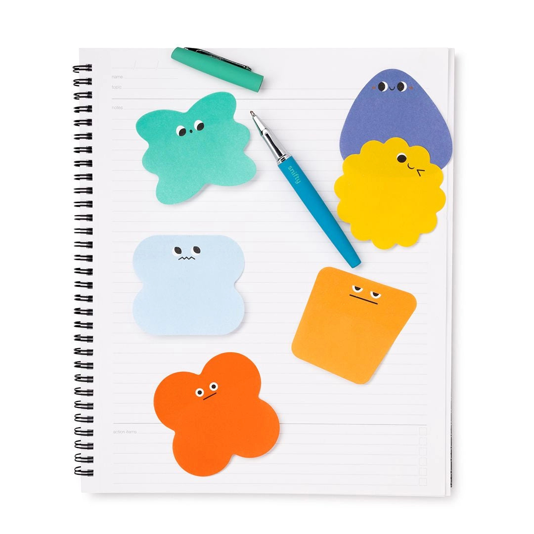 Lil' Moods Sticky Notes with colorful character shaped notes on a lined notebook