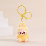 Labubu Flocking Keychain with fuzzy texture and playful smile attached to yellow keyring accessory.