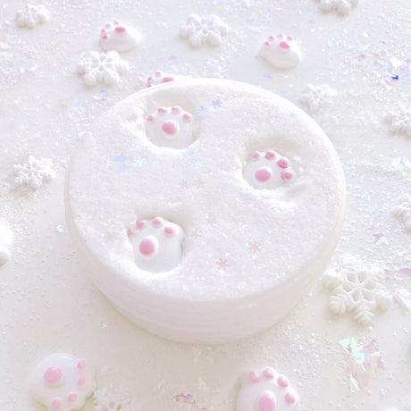Polar Bear Tracks Cloud Slime is fluffy white with sparkling texture and soft pink paw prints on top.
