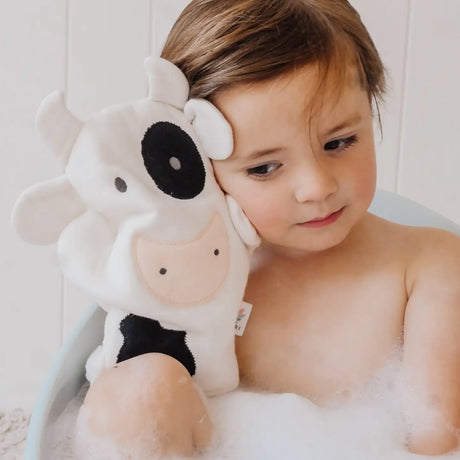 Farm Bath Mitt | Cow held by baby in bubbly bath, soft cotton muslin fabric with embroidered details for gentle skin care.