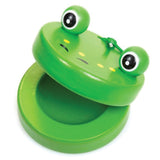 Green frog-shaped clacker toy with large eyes and a hinged mouth for making snapping sounds