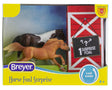 Horse Foal Surprise toy set with two horse figures in a red barn package