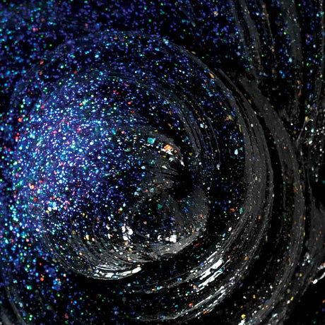 Cosmic Glows Star Dust Thinking Putty black with holographic glitter shimmering in light and glowing in the dark.