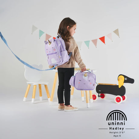 Toddler Lunchbag | Unicorn in purple with insulated compartments, padded handle, and fun unicorn design carried by young child.