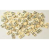 Scattered classic domino tiles with black dots on a light background ready for family game time or friendly competition
