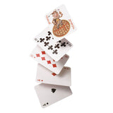 Stack of classic playing cards including aces, tens, and a joker card with playful design on white background