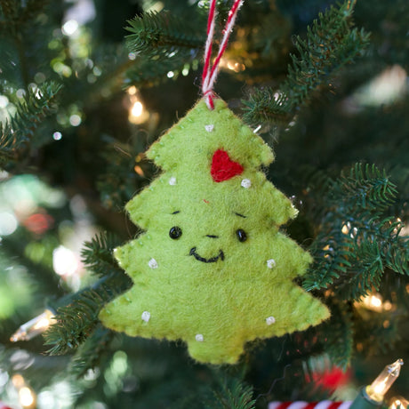 Smiling Christmas Tree Felt Ornament hanging on tree, handmade colorful sheep wool decoration from Nepal.