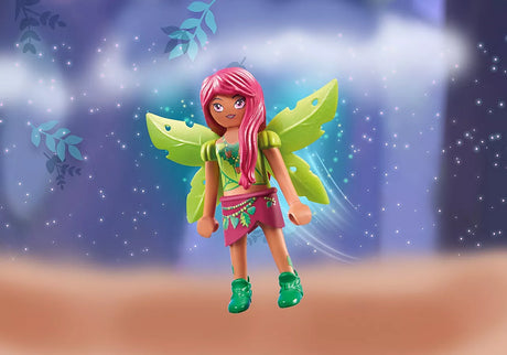 Ayuma | Forest Fairy Leavi toy figure with green wings, pink hair, and magical forest background.