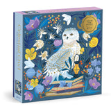 500-piece foil puzzle featuring a detailed celestial owl surrounded by colorful flowers and foliage on a dark background