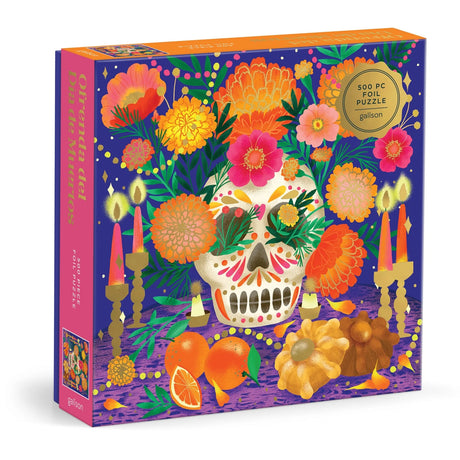 500-piece foil puzzle featuring colorful Day of the Dead skull, vibrant flowers, candles, and traditional elements on purple background