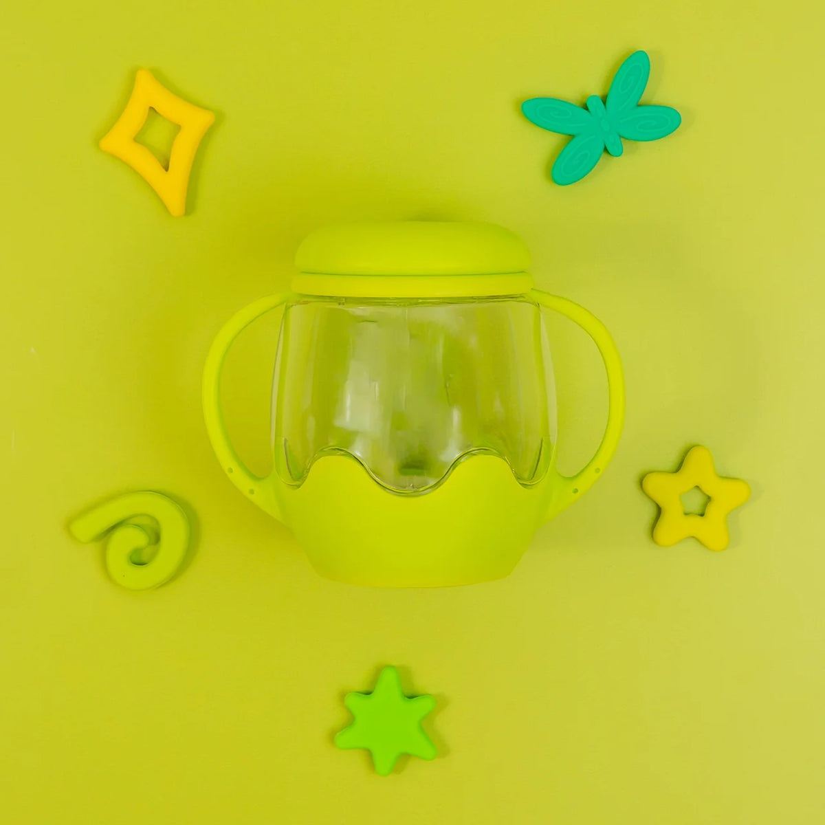 Mini Sensory Jar | Green sensory jar surrounded by colorful star, butterfly, and spiral shapes