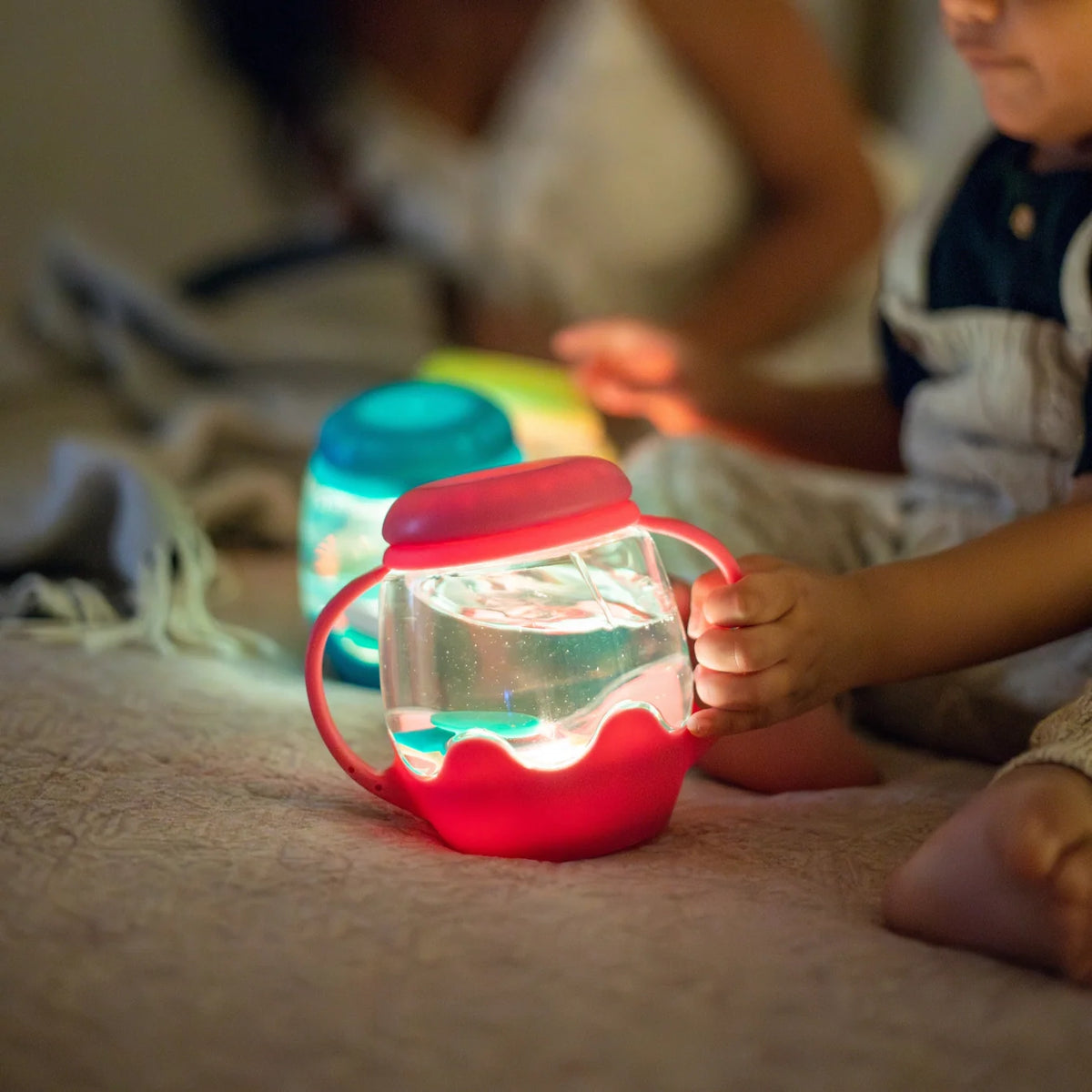 Mini Sensory Jar | Pink glowing as a child explores it