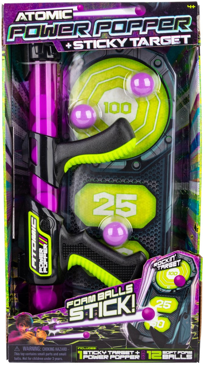 Purple and black Atomic Power Popper toy with green sticky target and soft foam balls in packaging