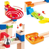 Colorful marble run set with wooden tracks, ramps, and spinning red funnel piece for DIY marble racing fun