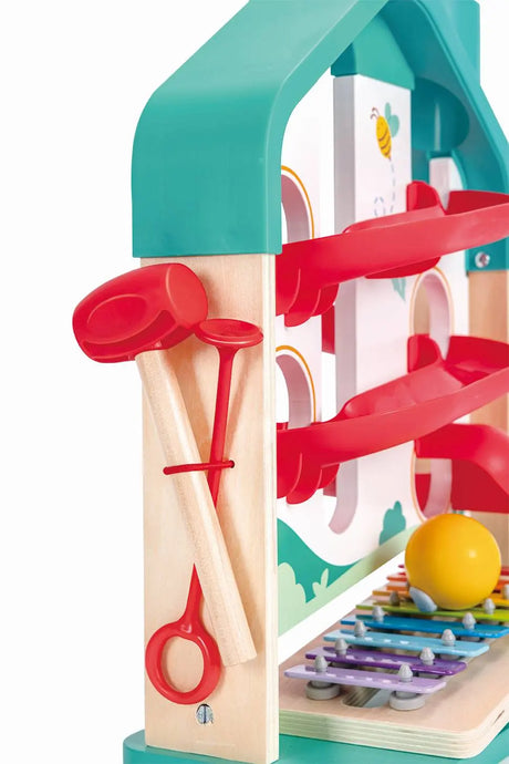 Melody Mansion Ball Run wooden house toy with colorful ball tracks and rainbow xylophone for musical play.
