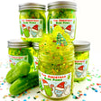 The Christmas Pickle Clear Slime jar with bright green sparkly slime, holiday glitter, pickles, and Christmas charm inside.