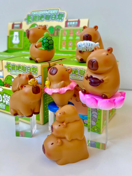 Capybara Life Blind Box resin figurines featuring cute capybaras with assorted animal designs and playful poses.