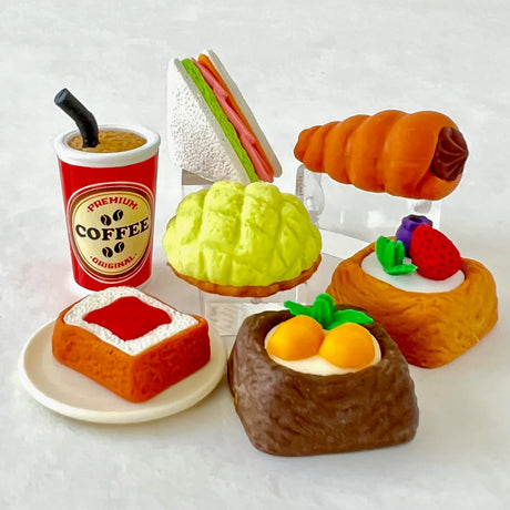 Colorful Japanese eraser set featuring coffee, sandwich, bread, and pastries designed as interlocking puzzle pieces